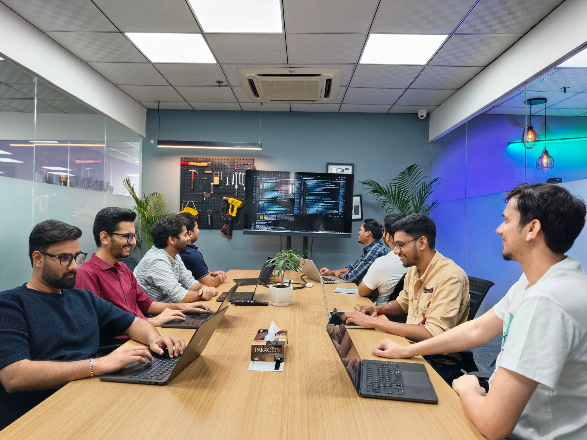 Sahil Jain working with a team of developers in an office